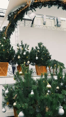 Green Christmas tree decorated with glass and wooden toys rusticの写真素材