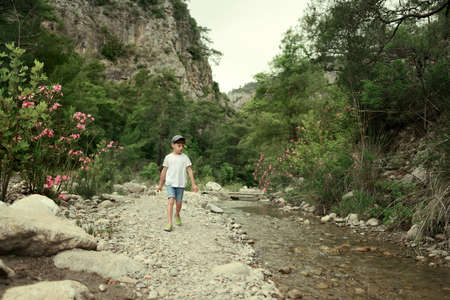 little boy by the riverの写真素材