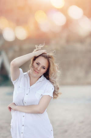 against the backdrop of the sea is a woman with long white hairの写真素材