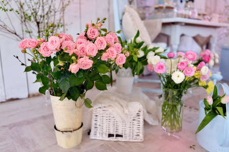 interior decoration of the room on the floor are vases with pink rosesの写真素材