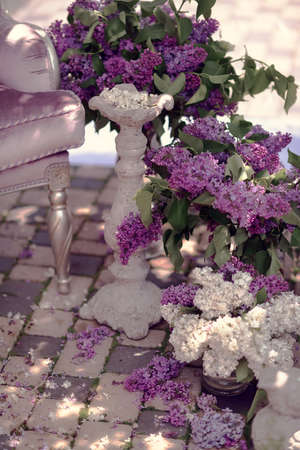 lilac composition on the street are vases with bouquets of lilacsの写真素材