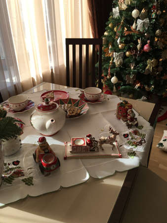 New Year's tea party at the table with a beautiful utensils and decorationsの写真素材