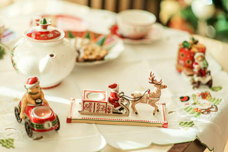 New Year's tea party at the table with a beautiful utensils and decorationsの写真素材