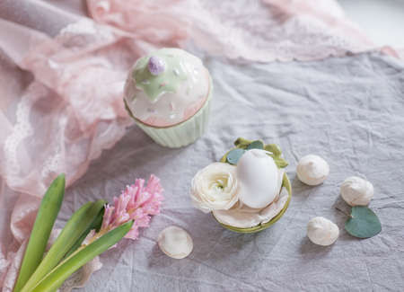 Easter still-life white egg on the petals and hyacinth, meringueの写真素材
