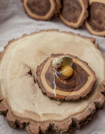 different size bars wooden deck and broken quail eggの写真素材