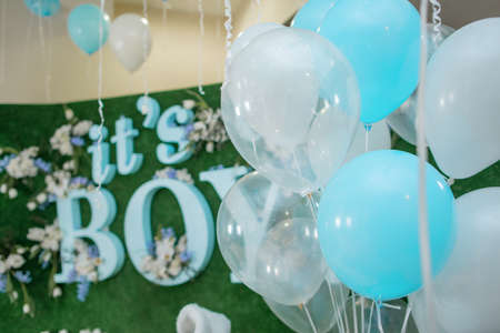 large balloons in blue, white and transparent tape on the whiteの写真素材