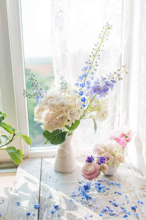 Vase with a delicate bouquet of pink rosesの写真素材