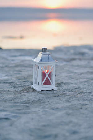 sunset over the estuary Kuyalnik shore with salt crystals and the lanternの写真素材