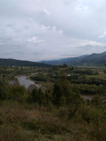 Ukrainian Carpathians mountain terrain, river and skyの写真素材