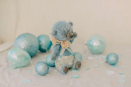blue on a white background bear with Christmas toys blue ballsの写真素材