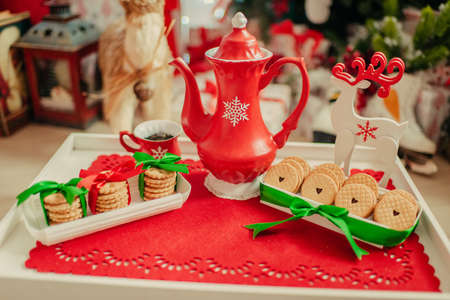 red porcelain teapot and cookiesの写真素材