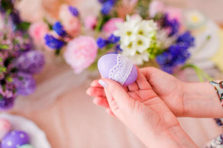in the hands of beautiful Easter eggsの写真素材