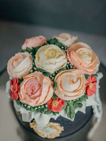 on a black background birthday cake decorated with beautiful rosesの写真素材