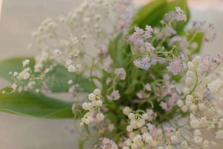 Very delicate, spring bouquet of lilies of the valley and forget-me-notsの写真素材