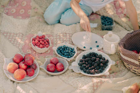 On the nature table is served with berries and fruitsの写真素材