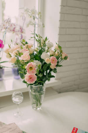 vase with flowers on the tableの写真素材