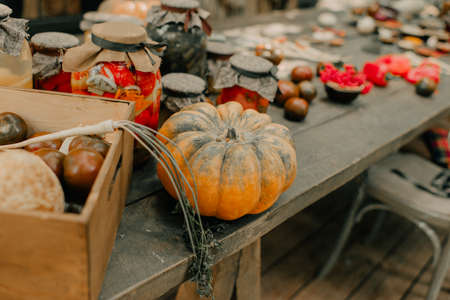 wooden table with vegetables and spicesの写真素材