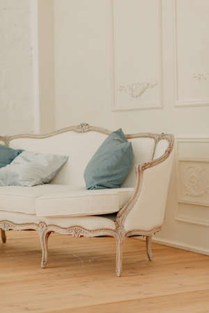 room in a vintage style with a bed on which the pillows lieの写真素材