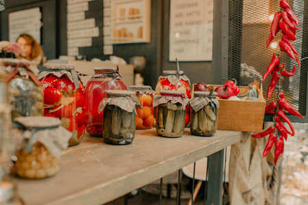 A rustic courtyard decorated in the style of a loft with a lot of canned vegetablesの写真素材