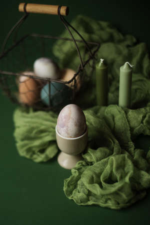 easter table decoration, easter eggs on green backgroundの写真素材