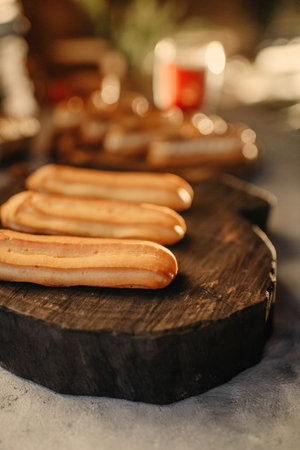 Homemade cakes, dessert eclair with cream and edible decorの写真素材