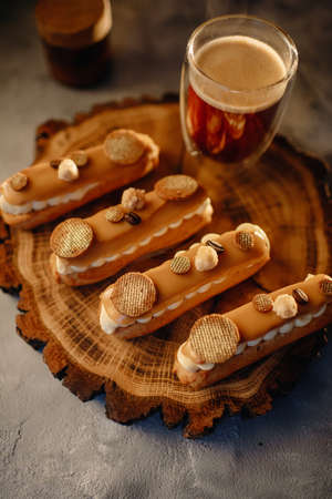 Homemade cakes, dessert eclair with cream and edible decorの写真素材