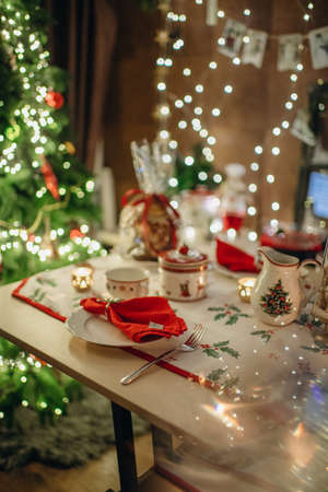 Christmas style table setting in red and green tones, dining room decorの写真素材