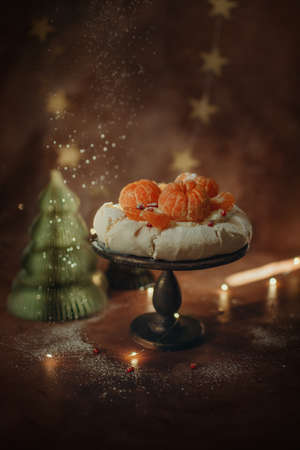 birthday cake with cream and fruits shot in a dark keyの写真素材