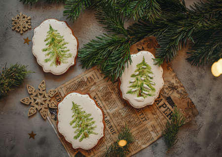 Dessert cake with cream in the New Year and Christmas decor on the background of the windowの写真素材