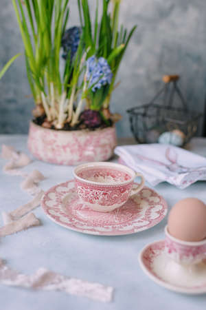 Spring Easter still life, Easter eggs in pastel colors with flowers