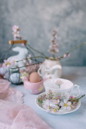 Spring Easter still life, Easter eggs in pastel colors with flowersの写真素材