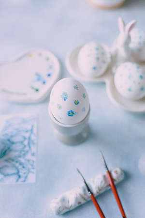 coloring eggs for the spring holiday of easter in blue tonesの写真素材