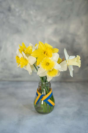 yellow flowers and the flag of Ukraine, Ukrainian symbolsの写真素材