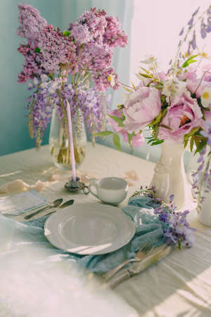decoration of the festive table with flowers in delicate colors and light shadesの写真素材