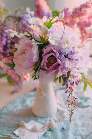 a bouquet of flowers for a holiday, a wedding in delicate pastel colors as a decor or table decorationの写真素材