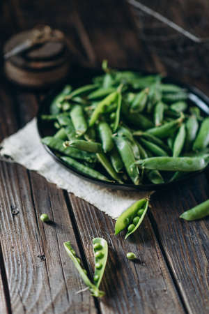 low key food photography, green peas vitamins, vegetarian foodの写真素材