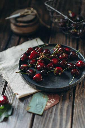 food photography in low key, fruit cherry vitamins, food for vegatarin