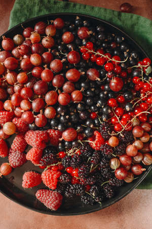 food photography in low key, fruits and berries vitamins, food for vegatarinの写真素材