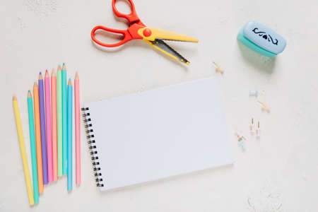 Flat lay composition with stationery on light background. Space for textの写真素材