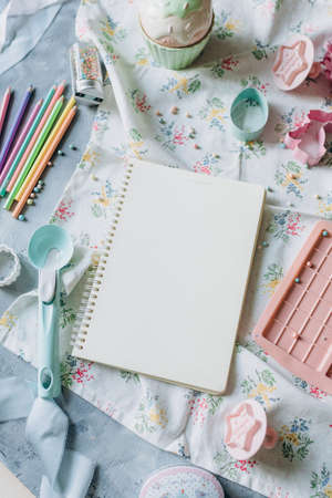 recipe book mockup on kitchen table with kitchen utensils in vintage styleの写真素材