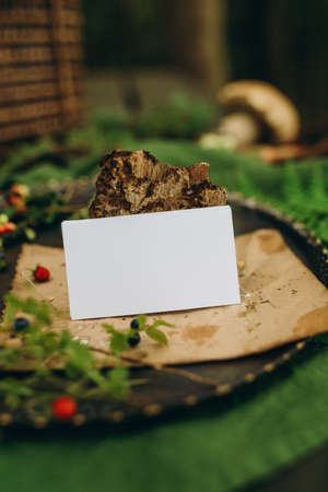 Blank white business card mockup on a wooden table.の写真素材