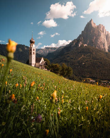 Sunset in Alpe di Siusi, with view of a churchの写真素材