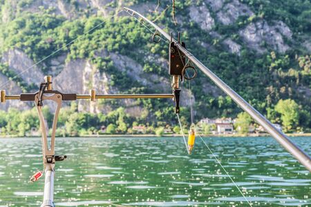 Fishing adventure - Carp fishing, close-up of a fishing rod resting on a rod podの写真素材