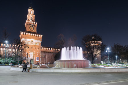 Milan, square Castello, Italy. Public pedestrian path in front of the castello Sforzesco (Sforza Castle) main entrance, 14 - 15th century, in the evening. The sforza castle is a symbol of Milanのeditorial素材