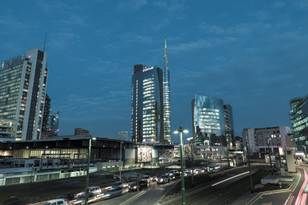Milan, Italy - February 17, 2017: Piazza Gae Aulenti at dusk, with the tallest skyscraper in Italy,...