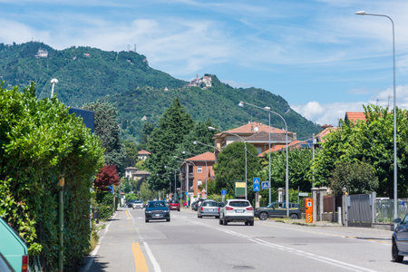 Characteristic view of Varese city with the Campo dei Fiori and the small village of Sacro Monte of Varese (top right), UNESCO site, seen from viale Aguggiariのeditorial素材