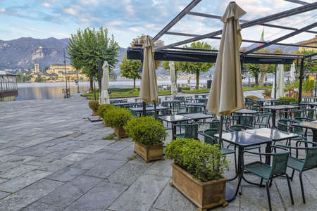 Orta lake with San Giulio island seen from the main square (piazza Motta - square Motta) of the...