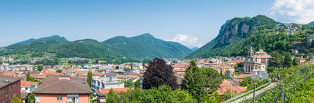 Panoramic aerial view of a Swiss city. Mendrisio with to the right the church of Saints Cosmas and...
