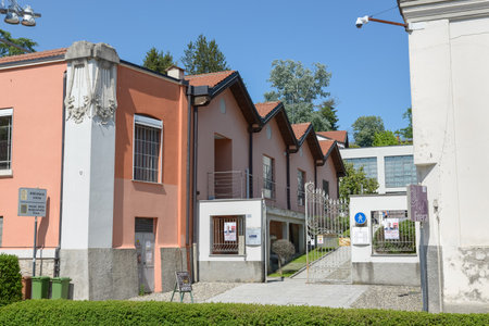 Tradate city, Italy. Frera Cultural Center. Entrance to the civic library and the Frera motorcycle museum, as written on the signのeditorial素材