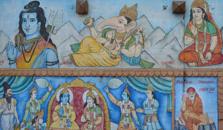 Shiva and Ganesh Hindu Deities Painted in a Street Wall in Varanasi, Indiaのeditorial素材